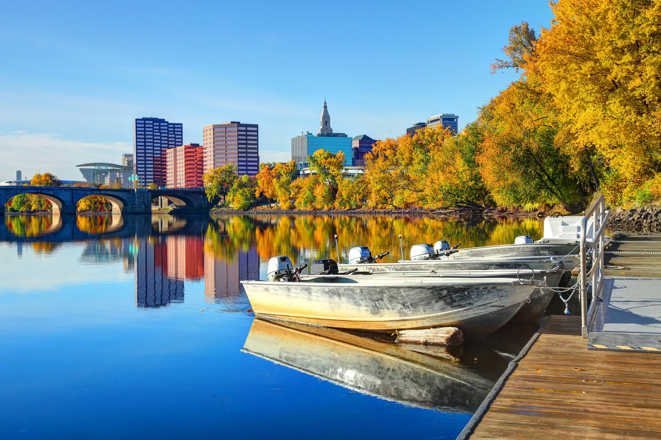 View of boats on water with Hartford in background on a Connecticut all inclusive Flight + Hote vacation package