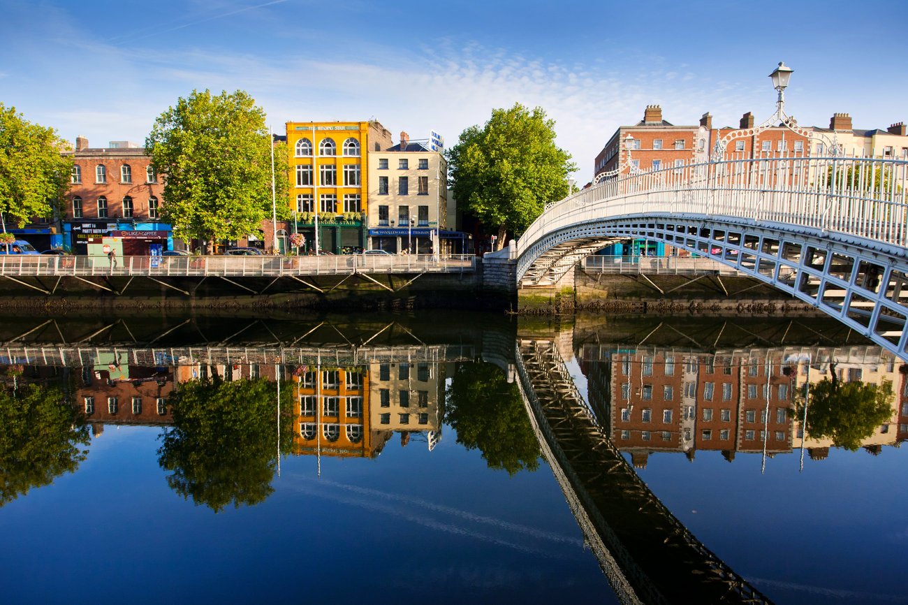 Bridge over river with city in background in Dublin, Ireland on a Flight + Hotel JetBlue Vacations Package