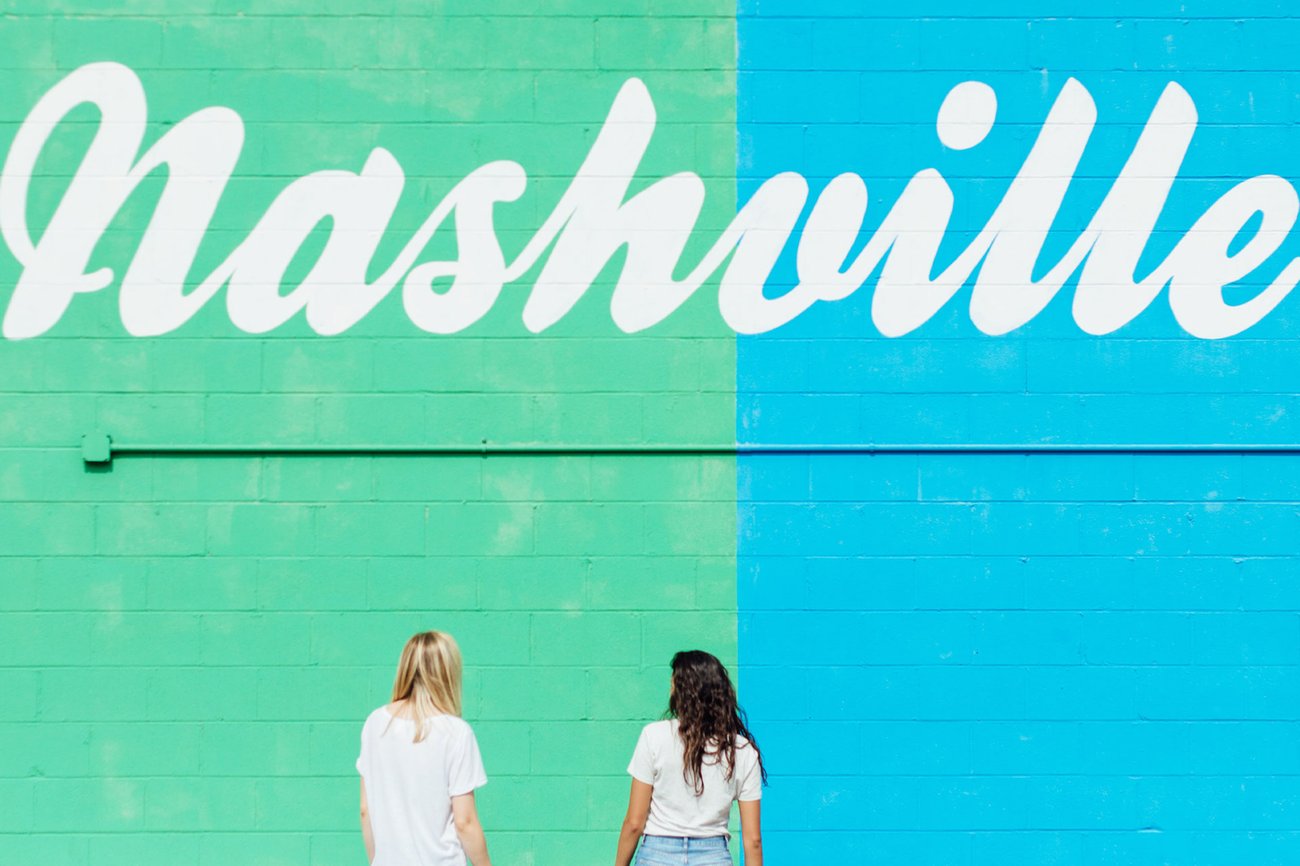 View of two women viewing a mural on a Nashville Flight + Hotel all inclusive JetBlue Vacations package
