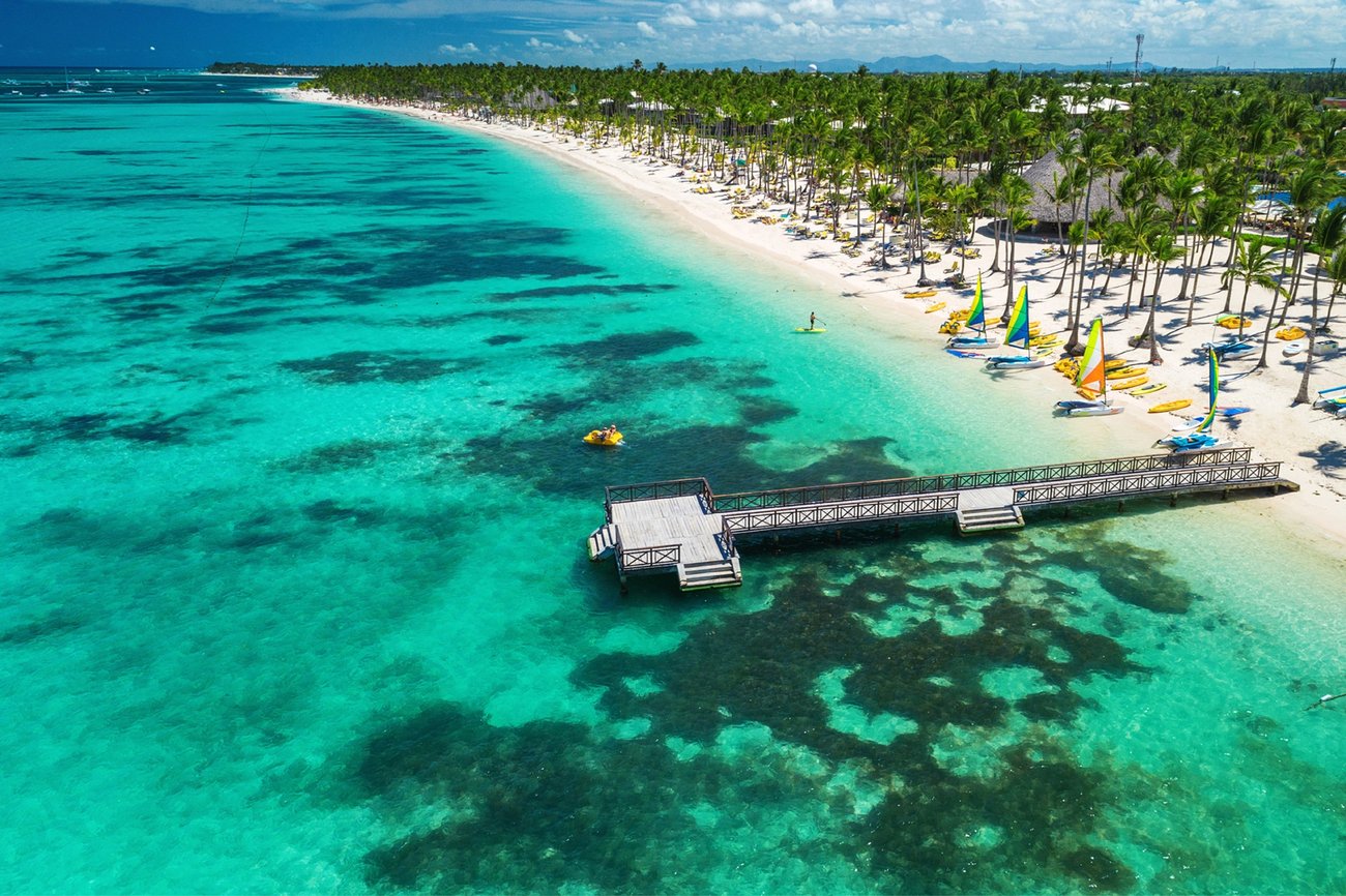Aerial view of beach with pier in Punta Cana, Dominican Republic on a Caribbean Flight + Cruise vacation package