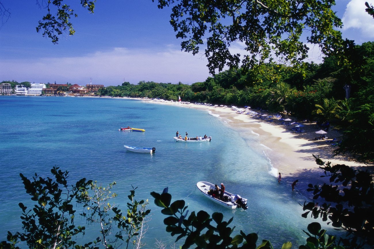 Aerial view of boats on water and beaches in Puerto Plata on a Flight + Hotel JetBlue Vacations all inclusive package