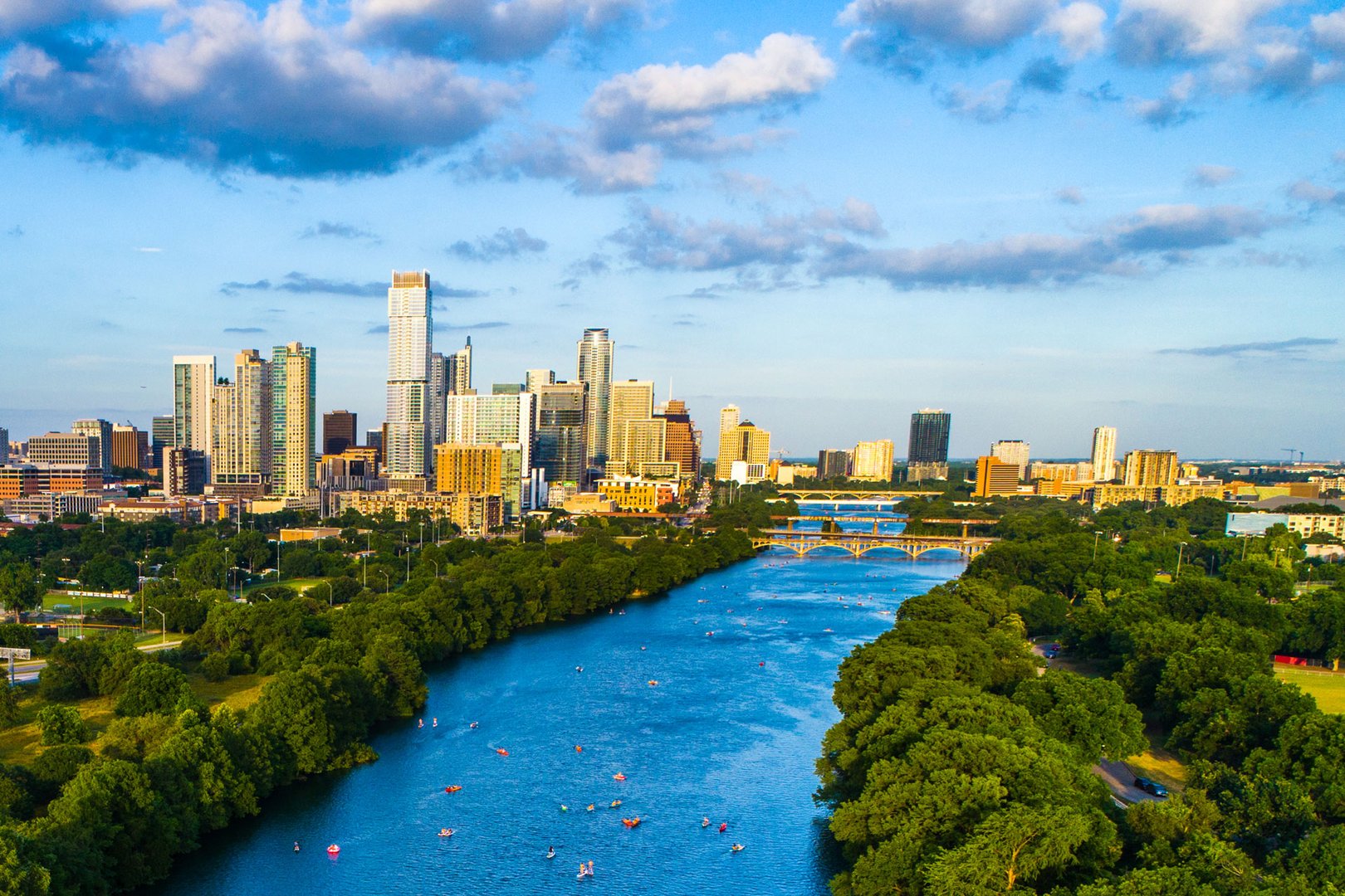 Aerial view of river, landscape and city of Austin on a Texas Flight + Hotel JetBlue Vacations all inclusive package