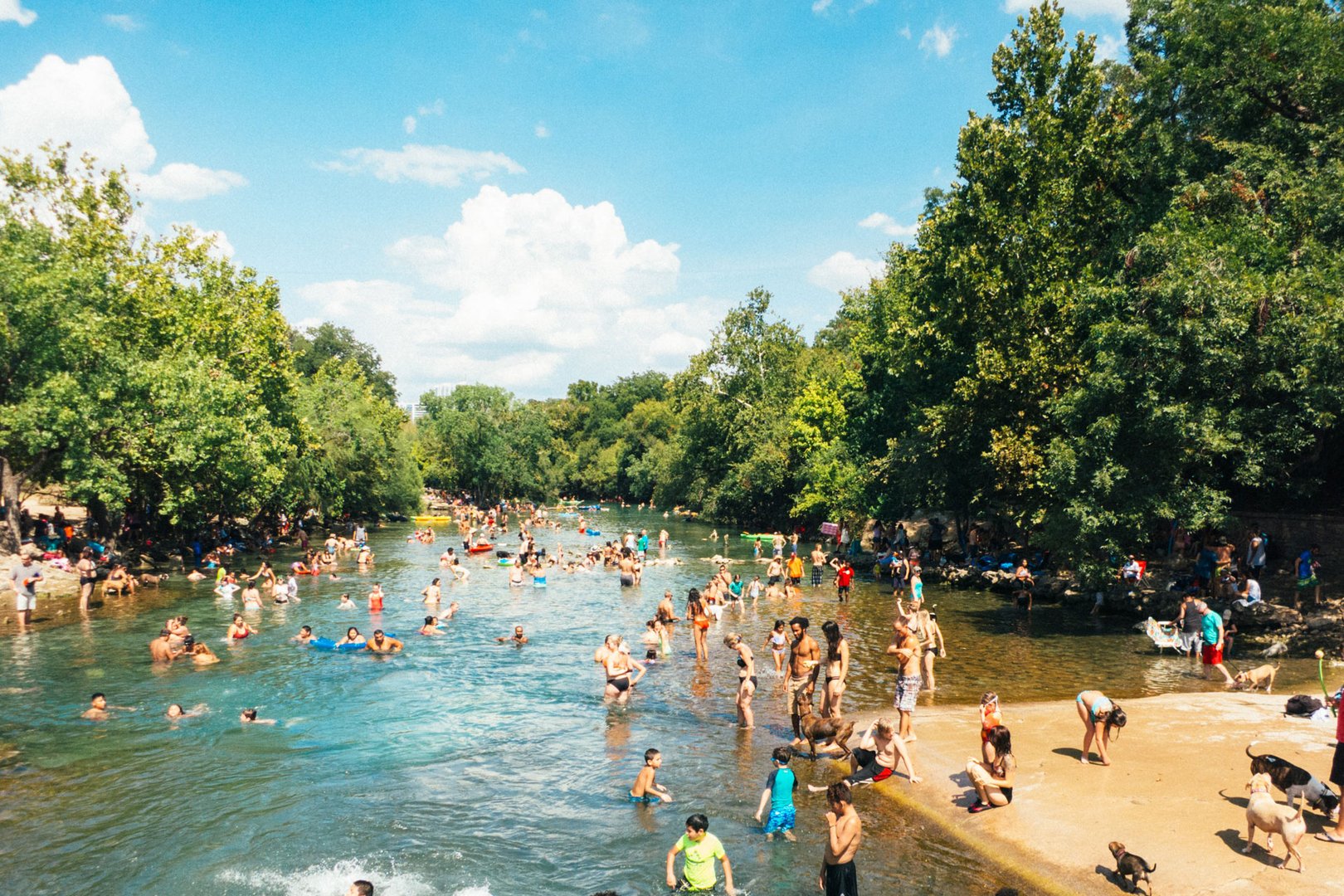 Aerial view of Barton Springs Pool in Austin on a Texas Flight + Hotel all inclusive vacation package