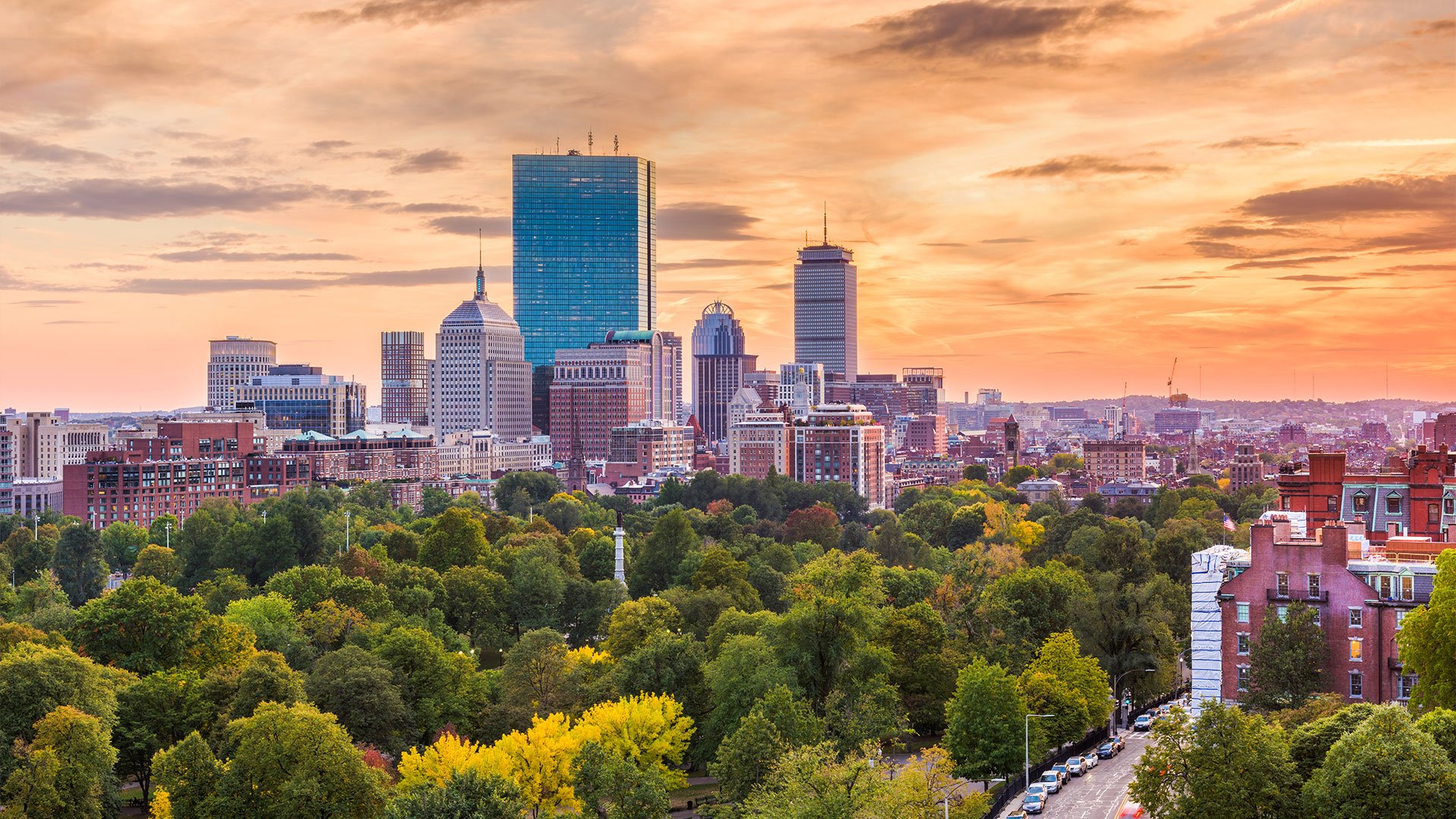 Aerial view of Boston and foliage at sunset on a Flight + Hotel vacation package JetBlue Vacations