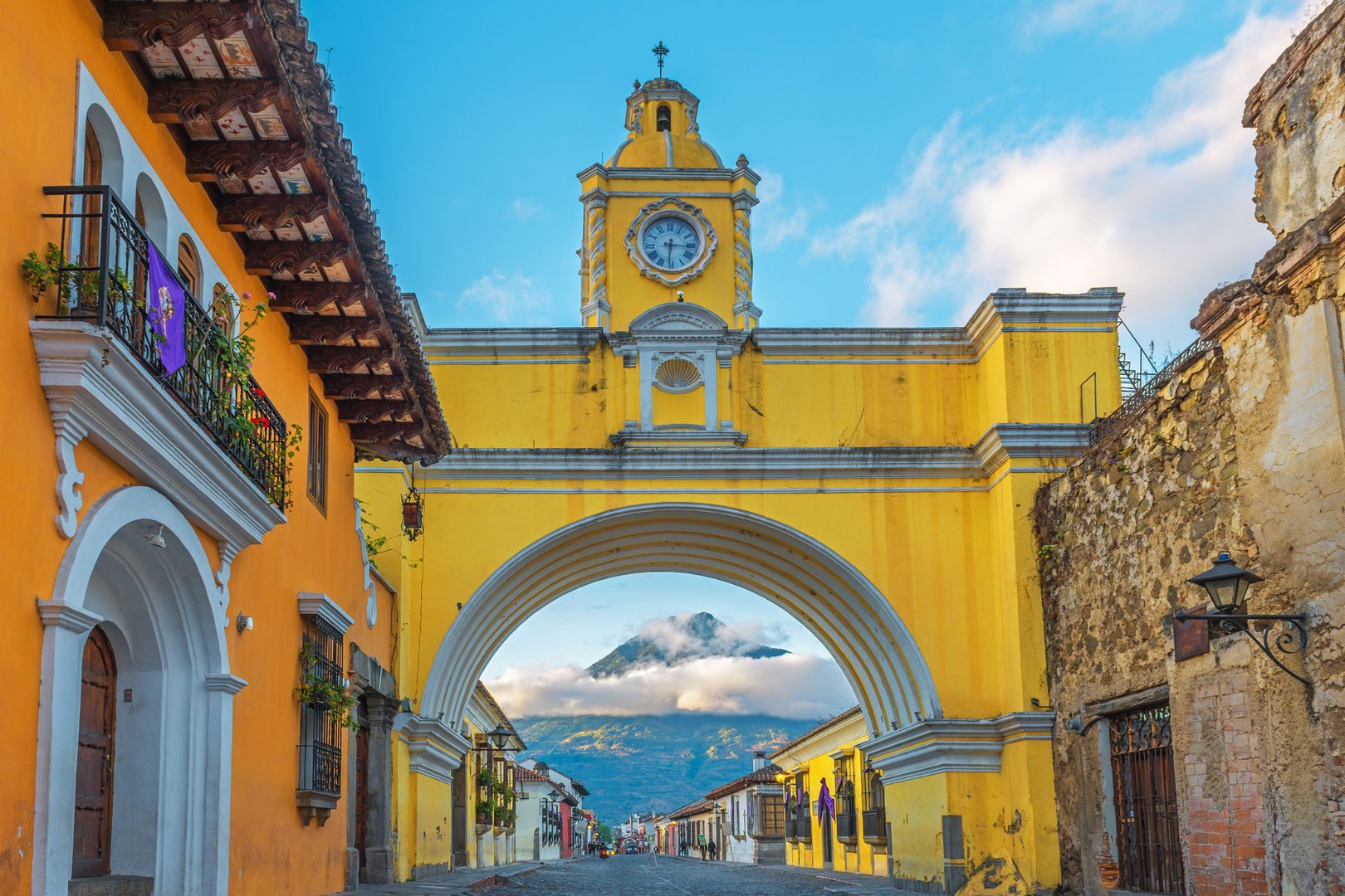 View of yellow gate and sea in distance in Guatemala City on a Flight + Hotel JetBlue Vacations package