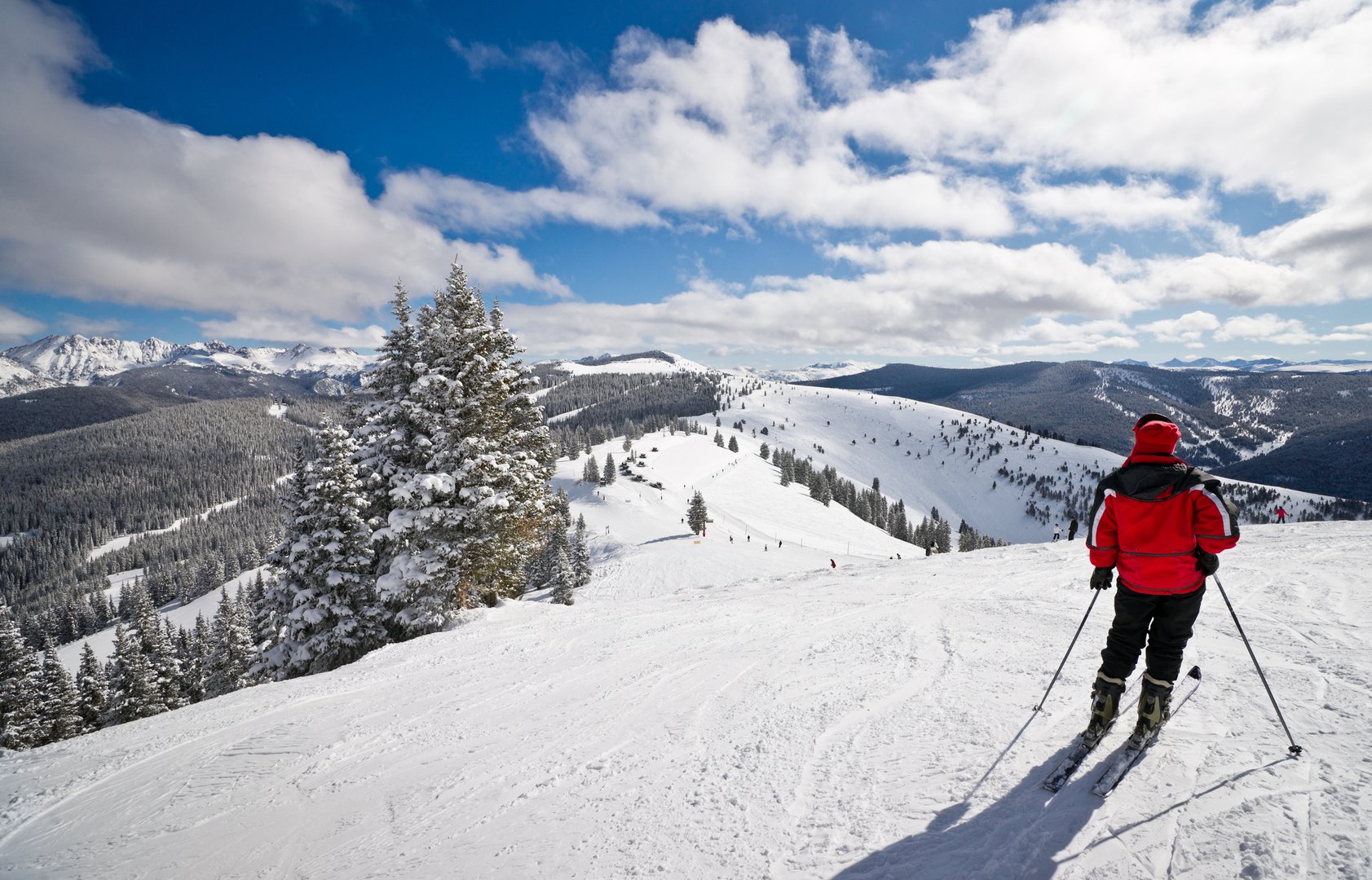 Aerial view of person skiing in Denver on a Colorado Flight + Hotel all inclusive vacation package