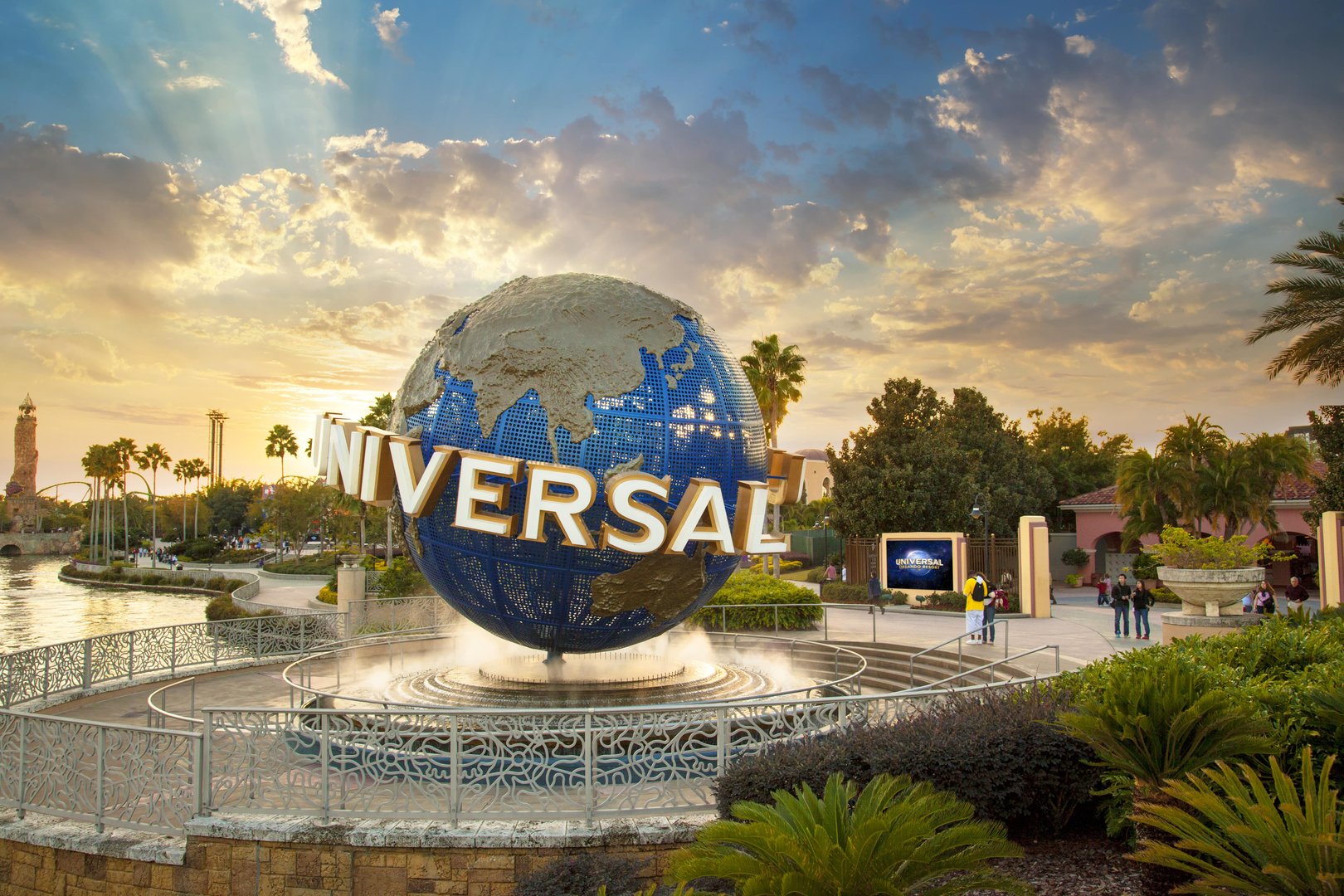 Iconic Universal Studios globe at entrance to Universal Orlando Resort at sunset