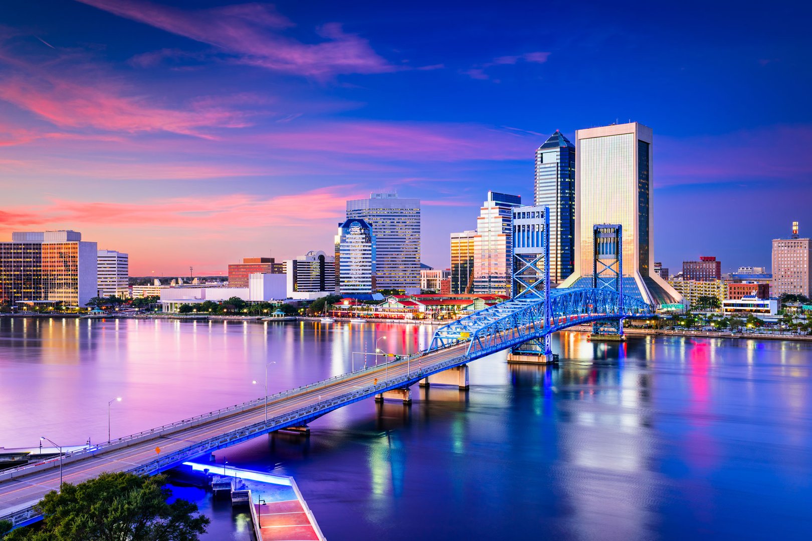 Aerial view of downtown Jacksonville and river at sunset on a Florida Flight + Hotel JetBlue Vacations package