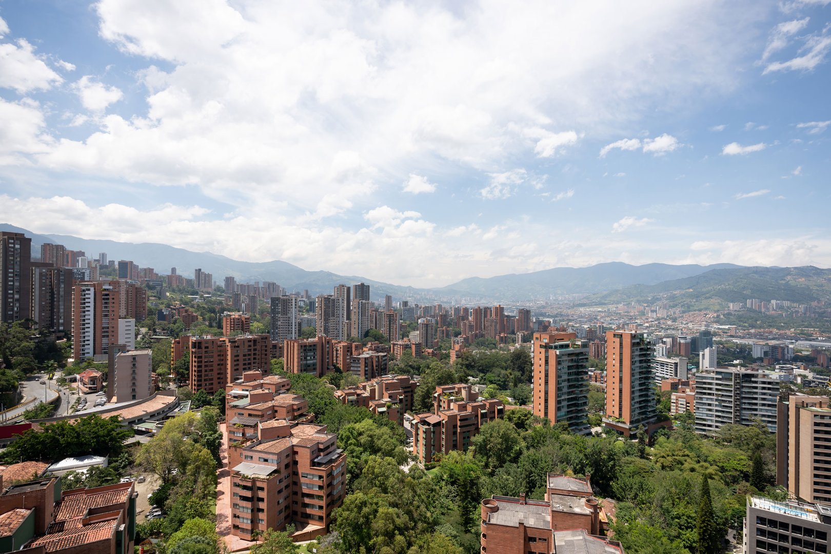 Aerial view of city on hillside in Medellin on a JetBlue Vacations all inclusive package to Colombia