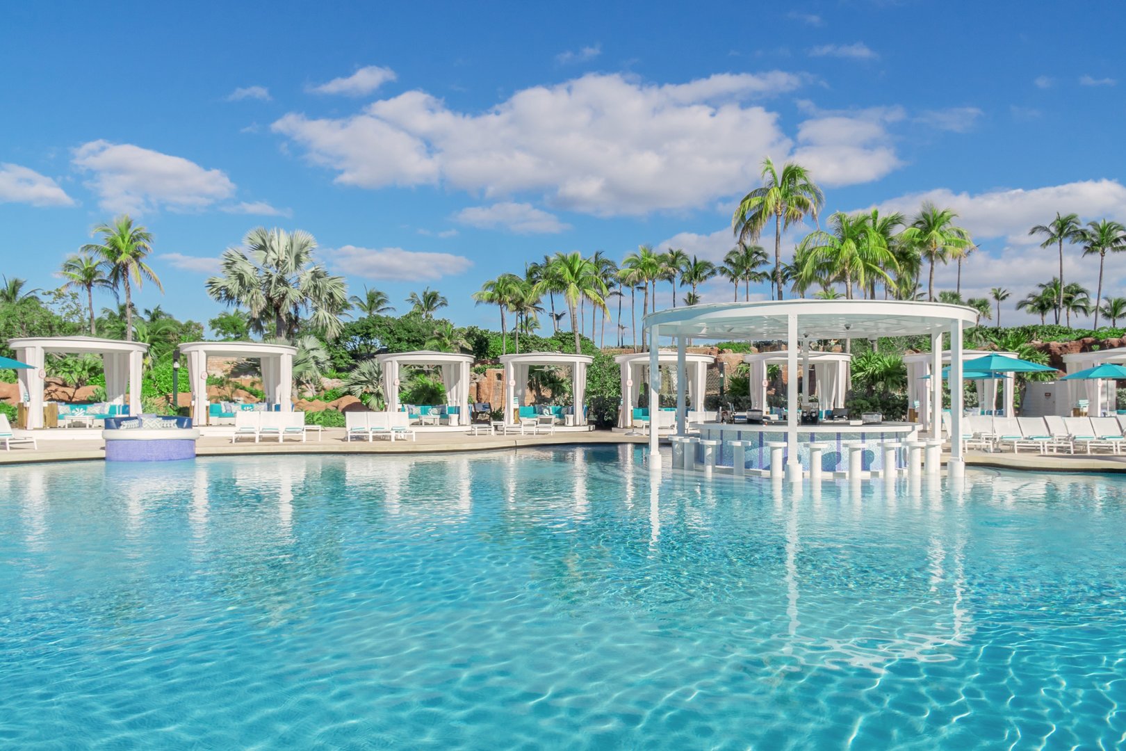 View of pools and swim up bar at Atlantis Resort on an all inclusive JetBlue Vacations package to the Bahamas