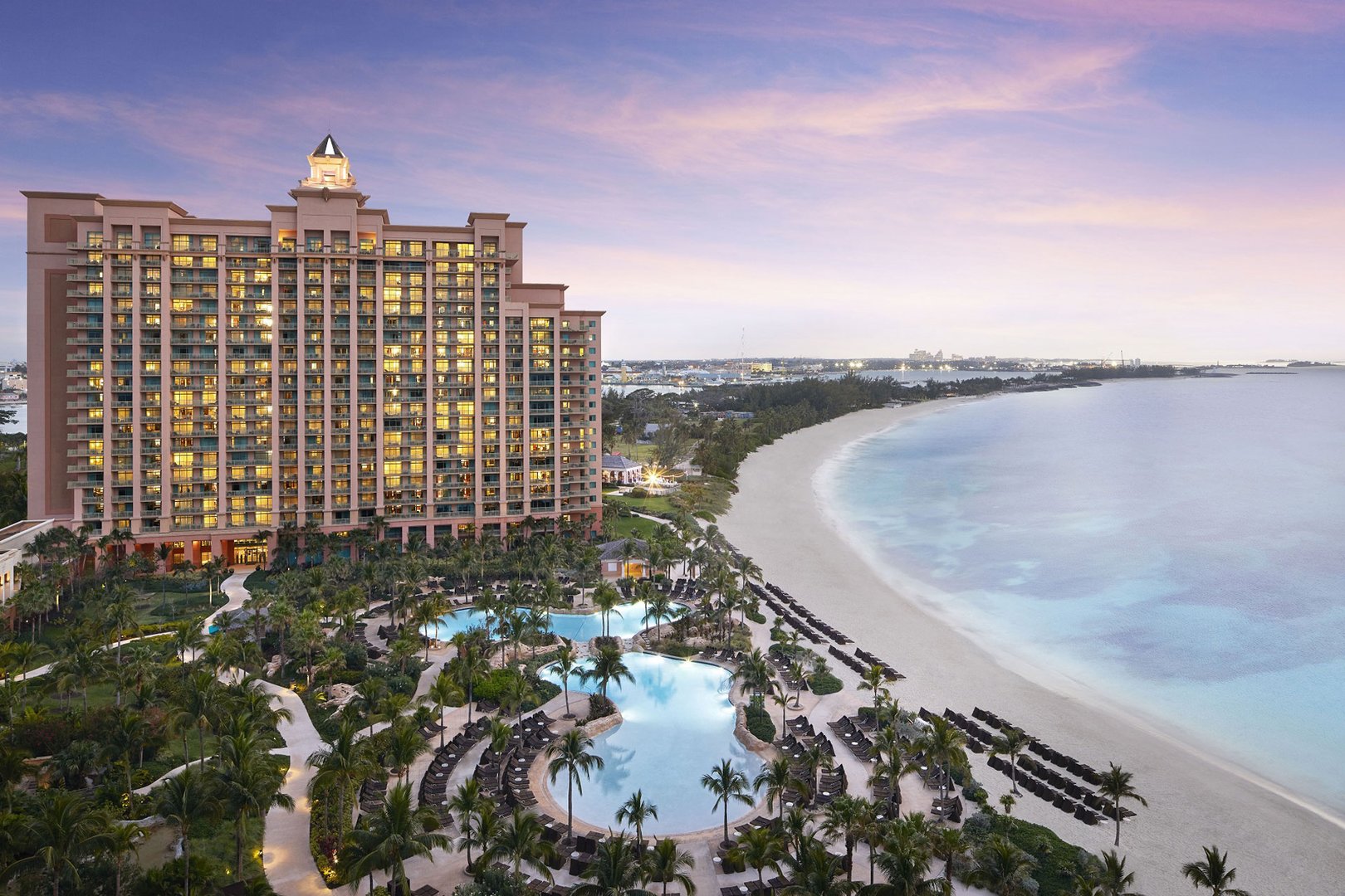 Aerial sunset view of Atlantis Resort and beach on a JetBlue Vacations all inclusive package to the Bahamas