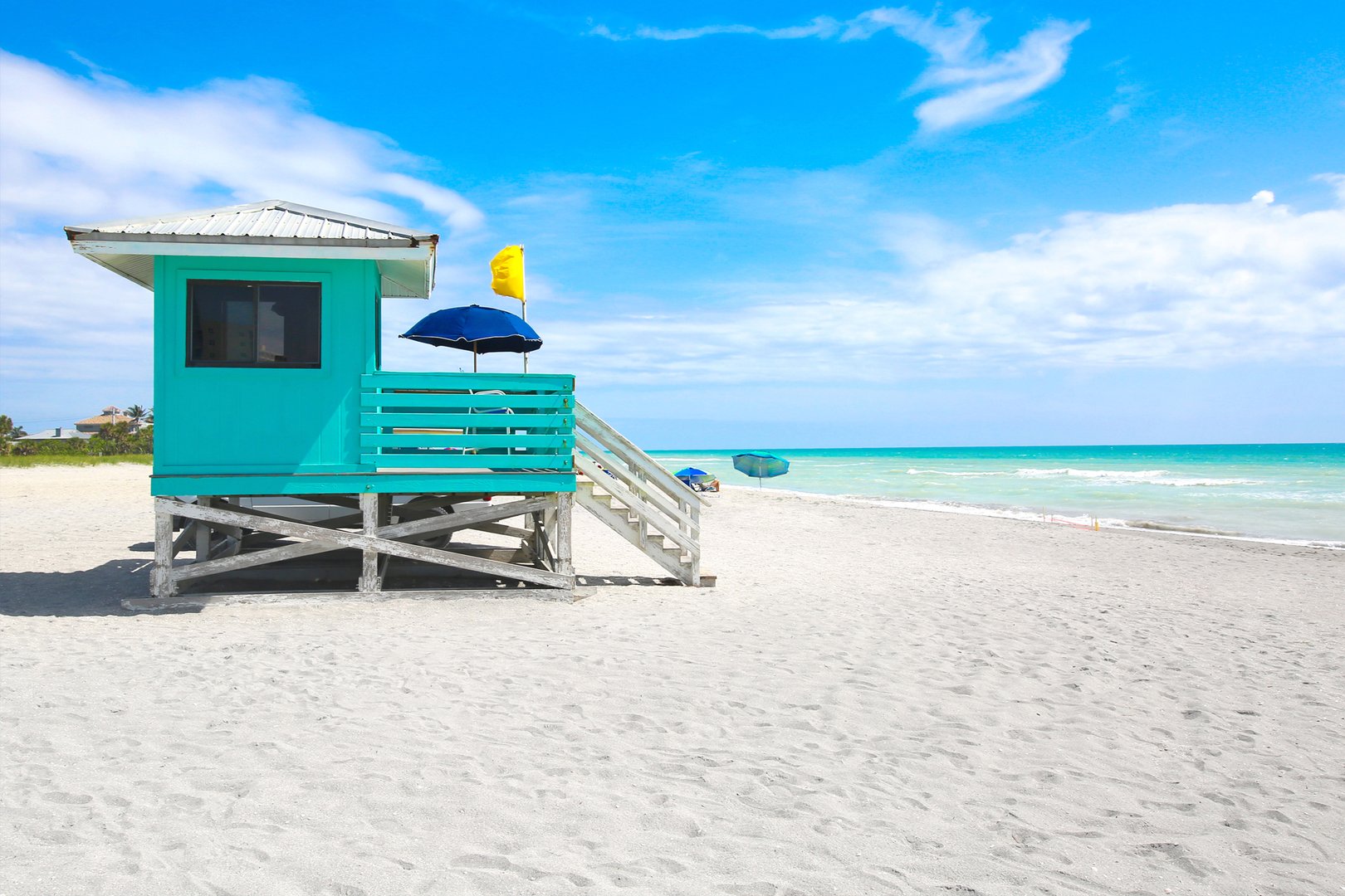 View of lifeguard tower on beach on a Sarasota Flight + Hotel all inclusive JetBlue Vacations package