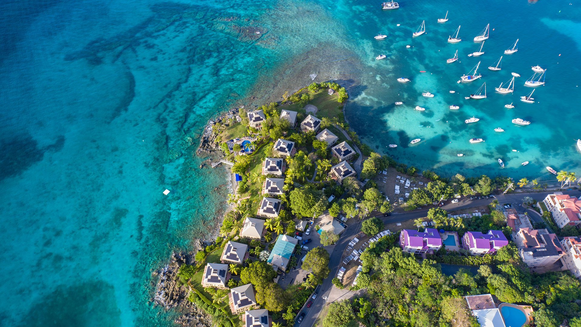 Aerial view of St. John, USVI and sailboats in water with a JetBlue Vacations All Inclusive Flight + Hotel Package