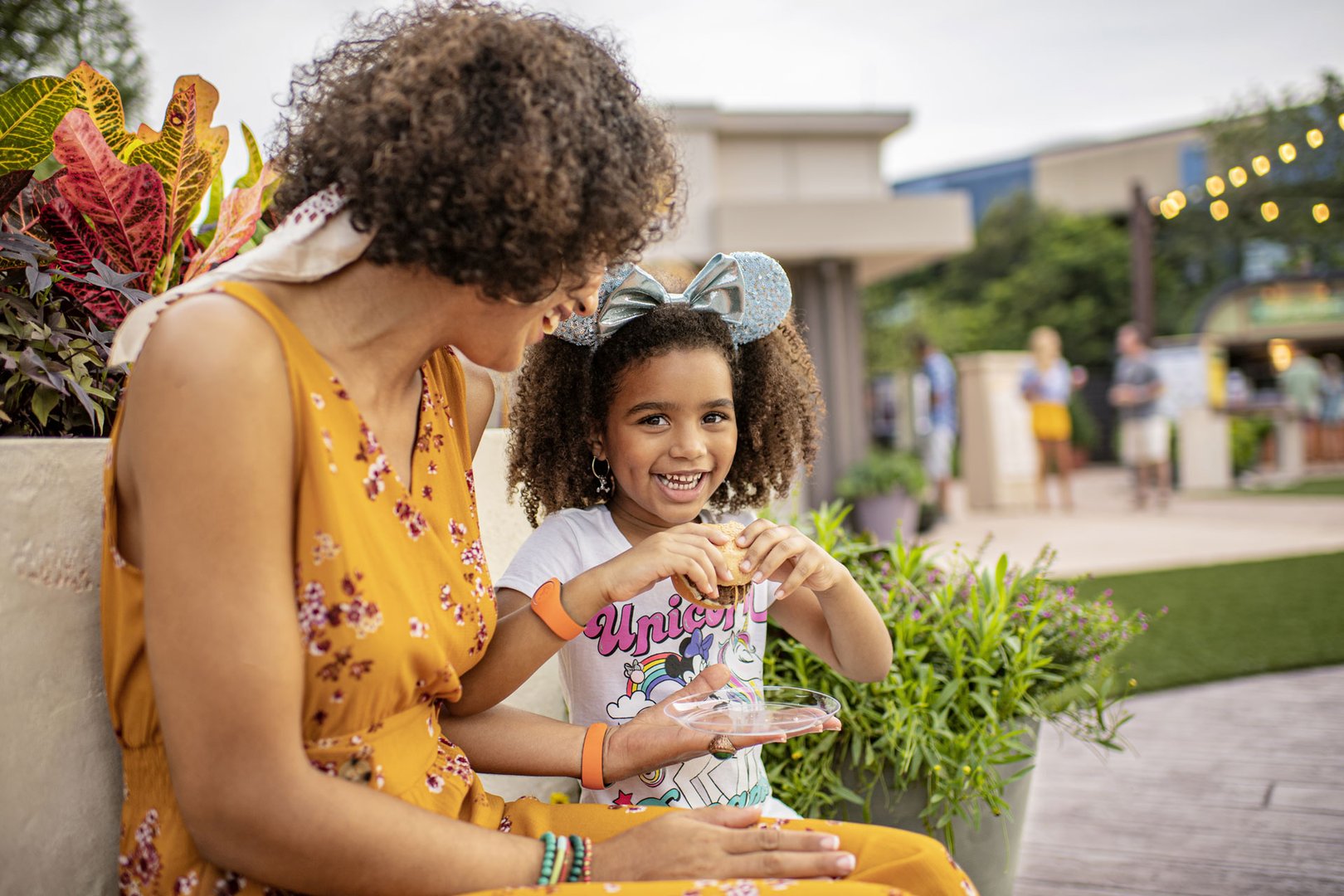 View of mother and daughter having a snack at Walt Disney World on a JetBlue Vacations package 