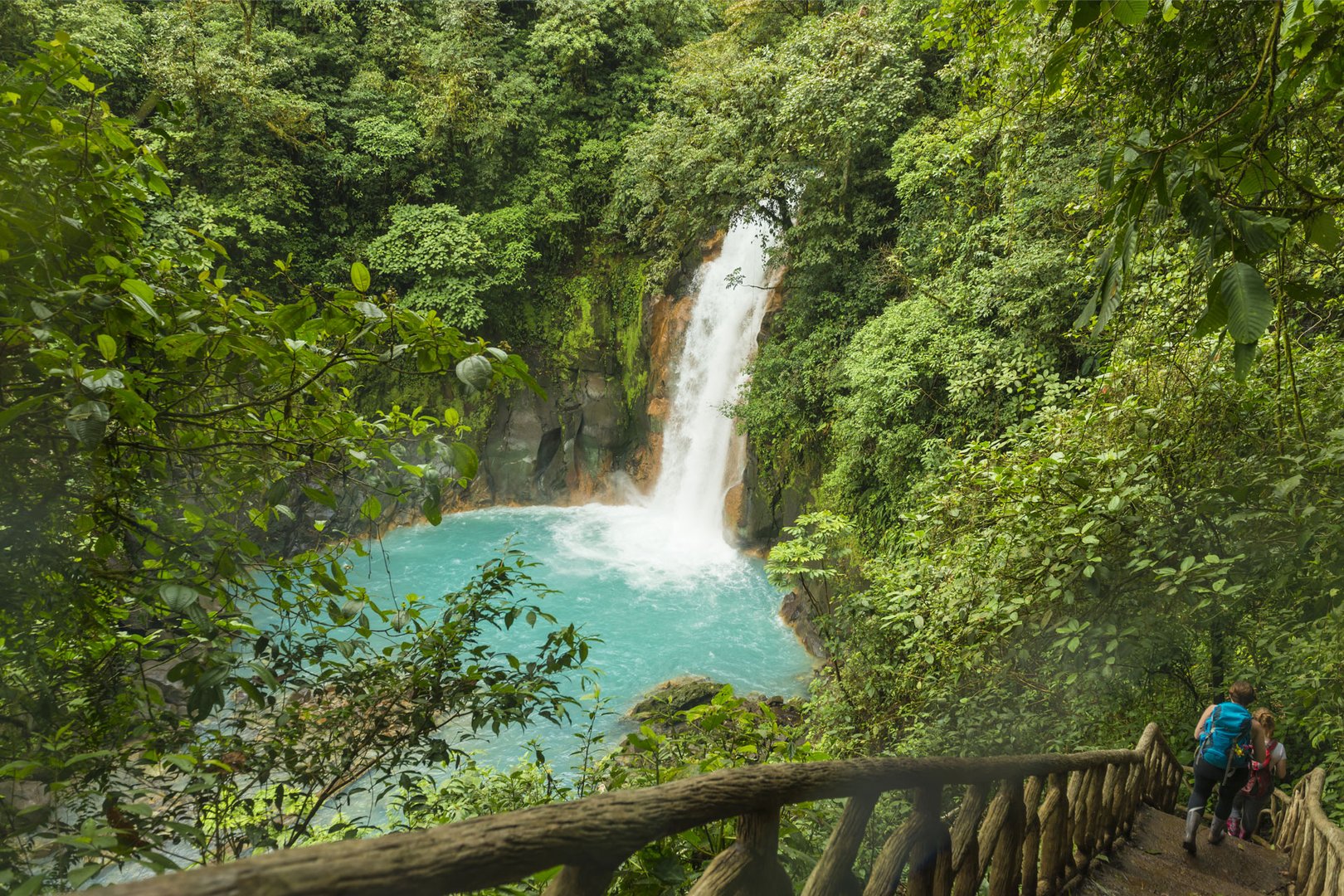Aerial view of hikers viewing foliage and waterfall on a San Jose Flight + Hotel JetBlue Vacations Costa Rica package