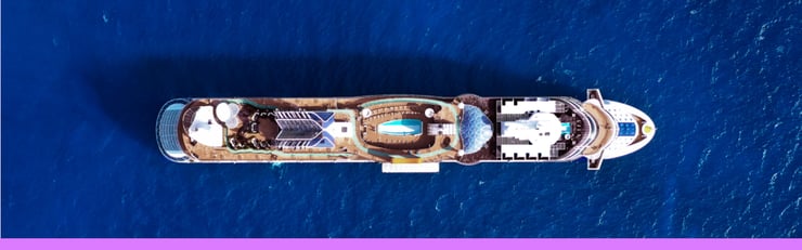 Aerial view of cruise ship at sea on a JetBlue Vacations Flight + Cruise all inclusive package with purple bottom border