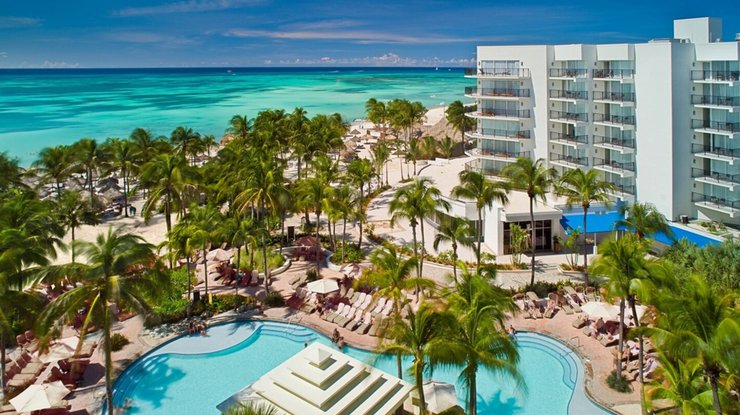 Aerial view of pool and beach at Aruba Marriott Resort and Stellaris Casino on a Caribbean Flight + Hotel package