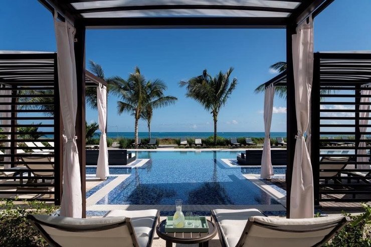 Pool view of The Ritz Carlton Turks and Caicos on a Flight + Hotel JetBlue Vacations Caribbean all inclusive package